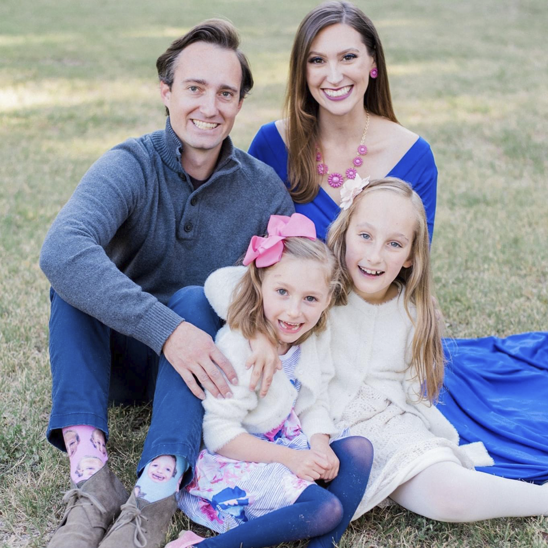 D.L. Frugé, wife Katie and daughters impacted by rare conditions smile in a family portrait